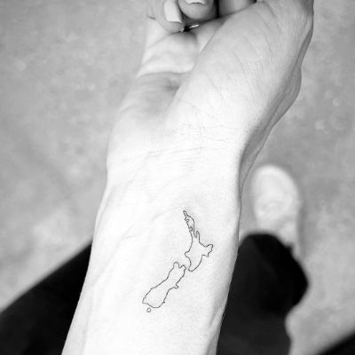 Michala Banas shows the tattoo of her home country, New Zealand.